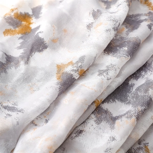 Detail of artistic gray ink wash texture on premium cotton-linen blend fabric shawl