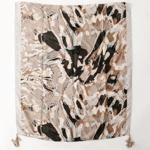 Lightweight cotton-linen feel scarf with abstract earth-toned pattern and fringe detail