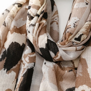 Detail of soft cotton linen shawl featuring artistic abstract print and neat stitching