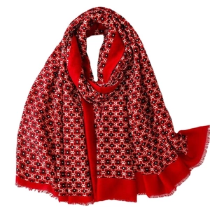 Red and black geometric pattern scarf with soft fringe trim and lightweight cotton feel
