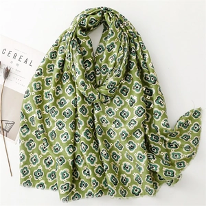 Soft green floral cotton linen scarf with gold stamping and delicate fringed edges