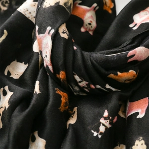 Macro shot of soft cotton linen scarf with cute Corgi dog print and pleated texture