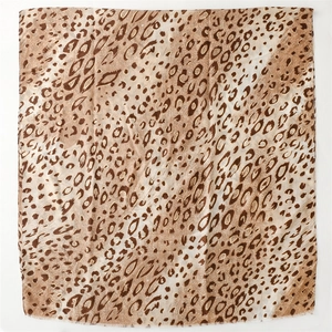 Detailed view of lightweight leopard print scarf with soft texture and frayed edge trim