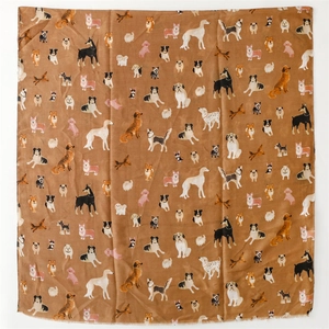 Detail of soft scarf featuring colorful hand-drawn dog patterns on silk-like fabric