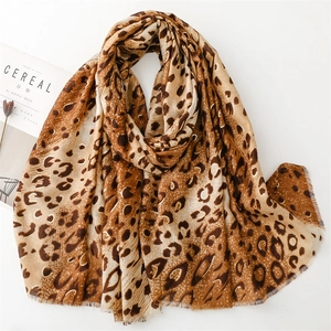 Elegant leopard print scarf for women with gold foil accents and fringe edges