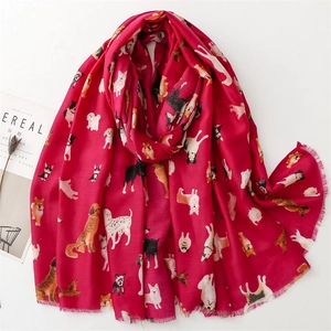 Red cotton linen scarf with cute cartoon dog prints and frayed edges on white background