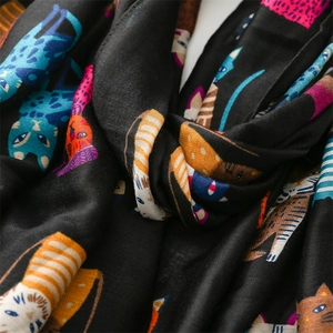 Detail of artistic colorful cat pattern on soft black cotton-linen feel scarf