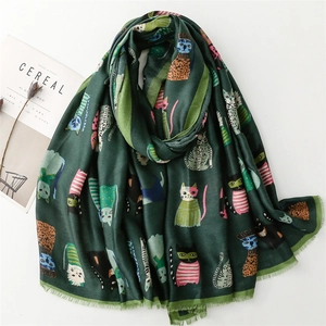 Dark green scarf with cartoon cat illustrations and fringe detail on white background
