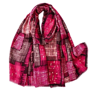 Rose red cotton-linen feel shawl with golden spiderweb pattern and fringed edges
