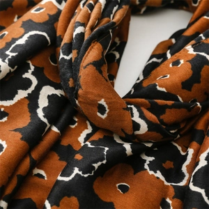 Macro shot of vintage floral pattern on soft cotton-linen fabric with twill texture