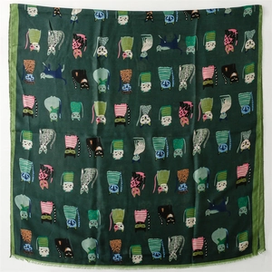 Flat lay of dark green cotton scarf featuring colorful pop-art cartoon cat patterns
