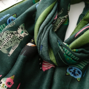 Detailed macro view of soft cotton linen fabric with colorful cartoon cat pattern