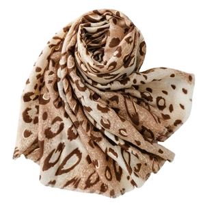Fashionable leopard print scarf with gold foil accents and fringe trim on a white background