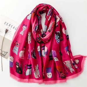 Detailed view of rose pink cotton-linen scarf with artistic cartoon cat illustrations