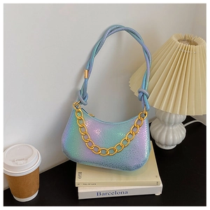 Detail of colorful iridescent gradient small square bag with chunky gold chain strap