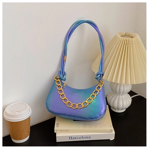Detail of gradient blue-purple laser shoulder bag with embossed texture and gold chain