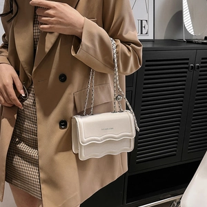 Fashionable cream-colored small square bag with wavy flap and silver chain for women