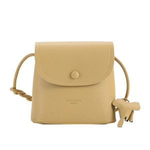 Mustard yellow pebbled leather crossbody bag with cute elephant charm and flap closure