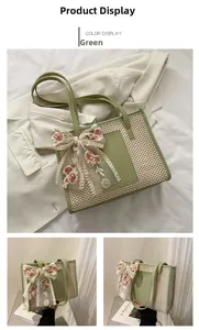 Detail of green straw woven tote bag featuring embroidered lace flower bow and leather trim
