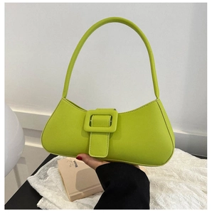 Close-up of lime green minimalist shoulder bag with large square buckle and flap closure