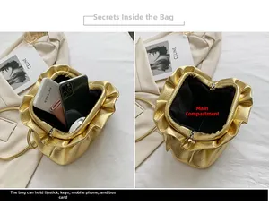 Internal view of gold pleated dumpling bag showing storage capacity and inner compartment