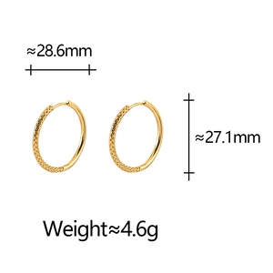 Detailed view of irregular gold hoop earrings with dimensions 28.6mm and 27.1mm size