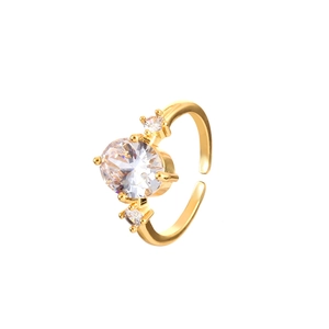Minimalist gold plated open ring with large oval zircon and side stones on white background
