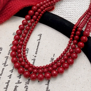 Multilayer red pearl beaded necklace with polished beads of varying sizes for women