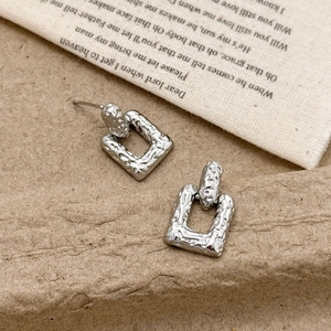 Minimalist silver square stud earrings with vintage hammered texture and hollow design