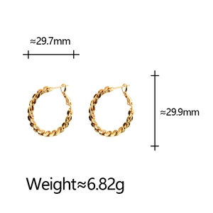 Detailed view of twisted gold hoop earrings with dimensions 29.7mm and weight 6.82g