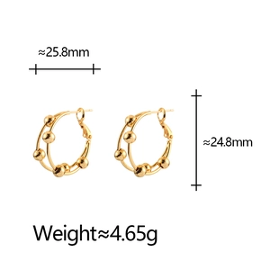 Detailed view of double layered gold circle earrings with beads showing exact dimensions