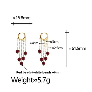 Detailed size view of gold tassel earrings with red pearls showing 61.5mm length