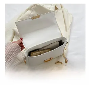 Detail view showing spacious interior of a white flap crossbody bag with phone and wallet