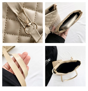 Detail view of beige quilted tote bag showing golden hardware and internal zip pouch