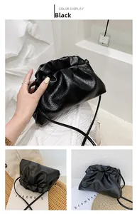 Detail showing high-quality black lychee leather texture and minimalist drawstring design