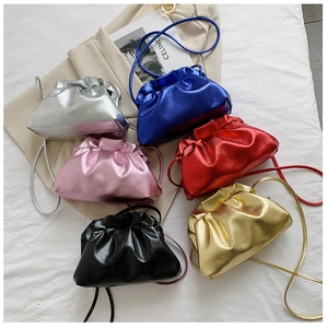 Close-up of pleated dumpling bucket bags in six metallic candy colors with straps