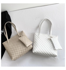 Detail of quilted diamond pattern tote bag set with matching small hanging pouch