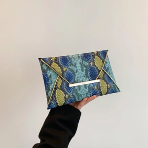 Blue and neon yellow python print envelope clutch with golden metal trim and buckle