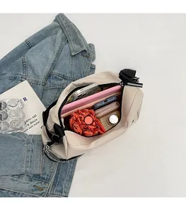 Spacious beige tote bag interior showing capacity for tablet, umbrella, and essentials