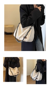 Detail view of large canvas tote bag featuring a bicolor braided rope handle and wide strap