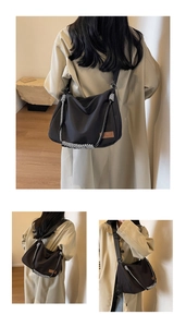 Detail of black nylon tote bag with braided checkered strap and leather logo patch