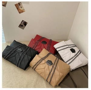 Quilted chain bags in black, red, white, and khaki with V-pattern stitching and metal clasps