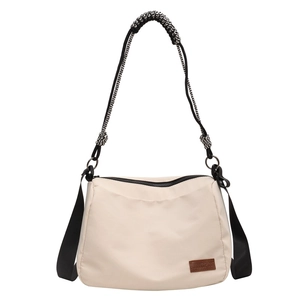 Large capacity beige canvas tote bag with black strap and leather logo detail