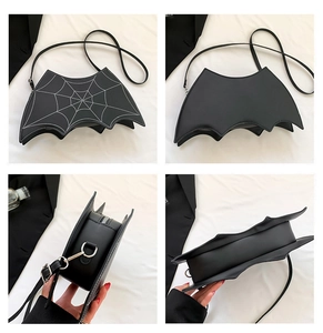 Detail view showing bat-shaped crossbody bag with spider web print and silver zipper