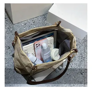 Top view of beige canvas tote bag showing spacious interior and secure zipper pocket