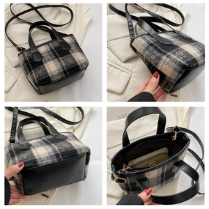 Detail view of plaid bucket bag showing interior capacity and golden hardware accents