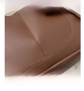 Close-up of brown PU tote bag featuring precision double stitching and matte finish