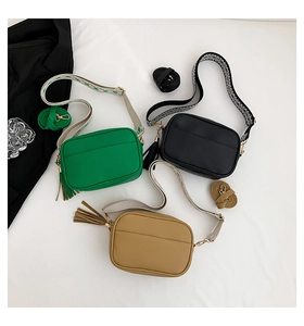 Detailed flat lay of three retro crossbody bags with jacquard and leather straps
