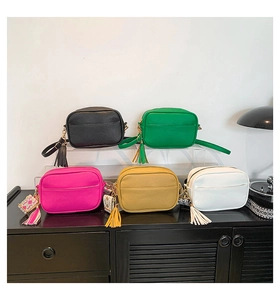 Detailed display of colorful PU leather crossbody bags with ethnic style wide straps