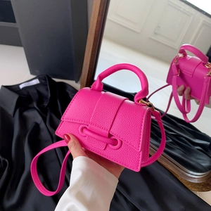 Mini flamingo pink lychee leather handbag with top handle and adjustable strap